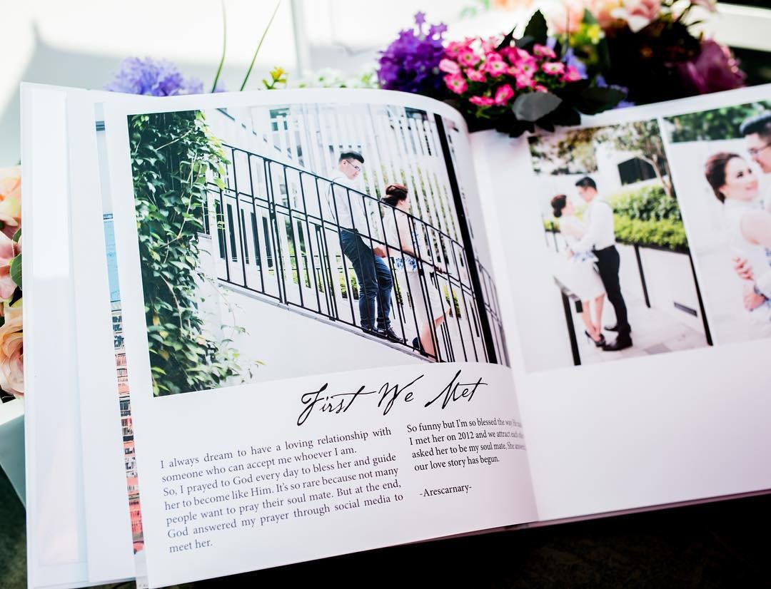 Open photobook spread with wedding photos and a written story page